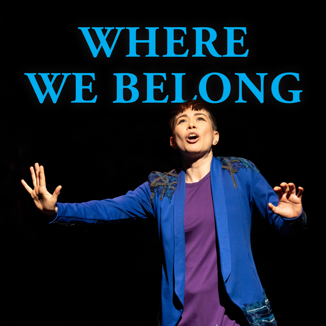 The title "Where We Belong" overlaid on a photo of a woman, her eyes closed, standing between fluorescent lights hanging at waist level.