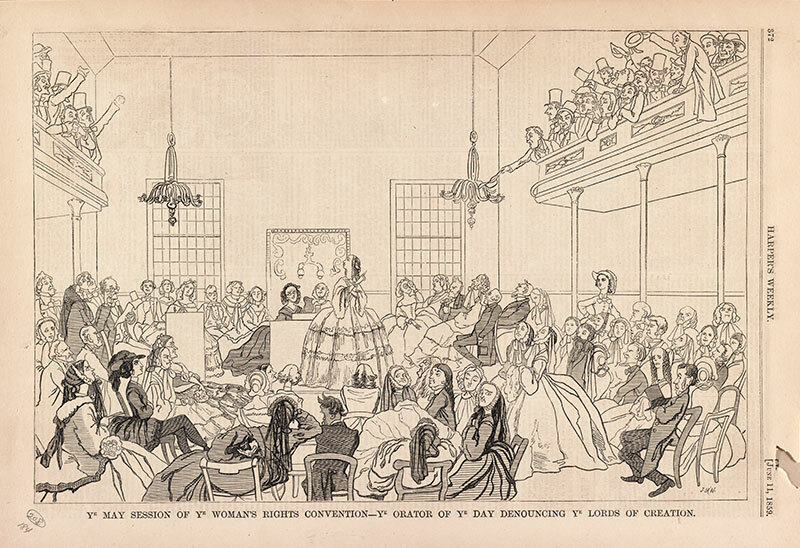 Print shows a group of women in a hall listening to a woman speaker who is pointing to the men sitting in an upper gallery.
