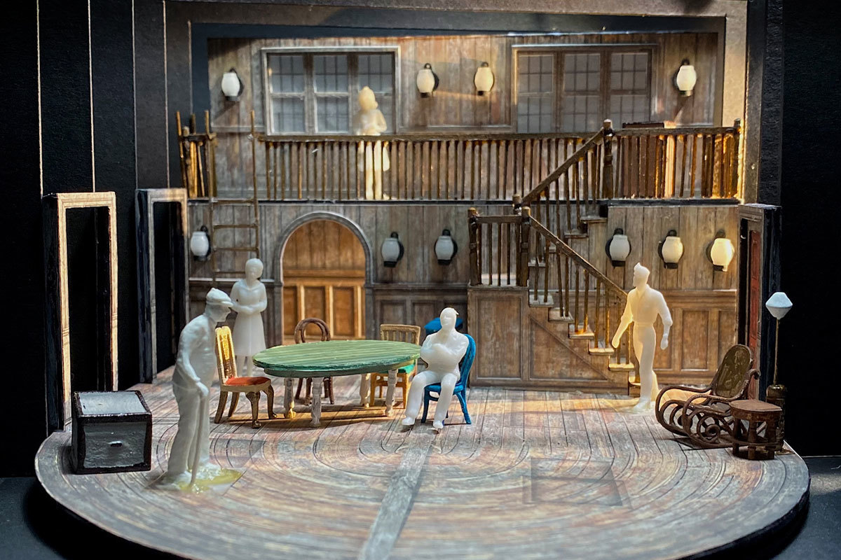 A full-color scale model of the scenic design for Gem of the Ocean, with scale-sized figures of people in the exposed interior of a house.
