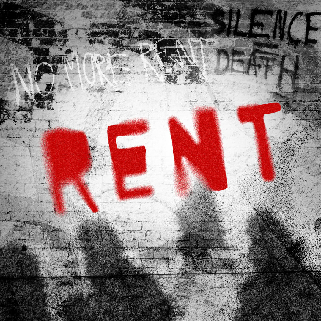 The word "Rent" in red stylized as graffiti on a black & white brick wall with other graffiti reading "no more rent" and "silence = death."