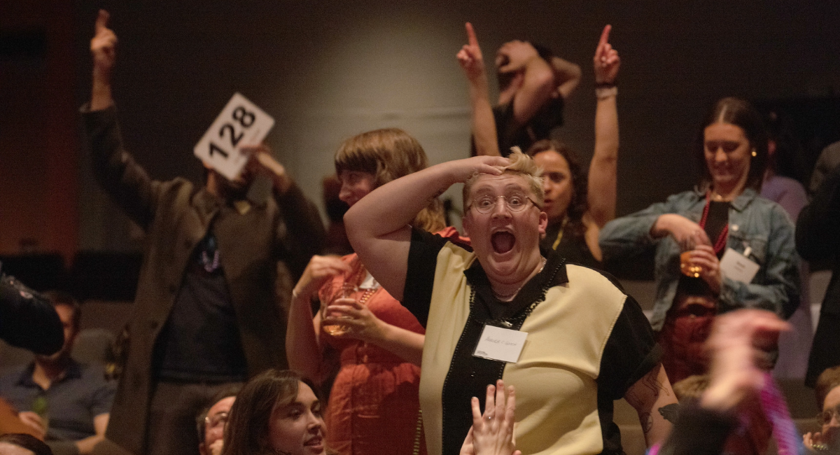 Auction Audience member having big surprised reaction