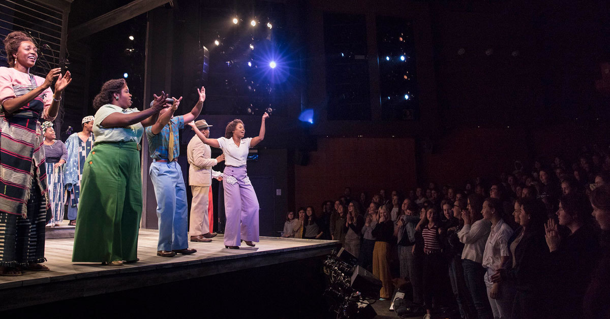 The cast of The Color Purple takes bows during a standing ovation.